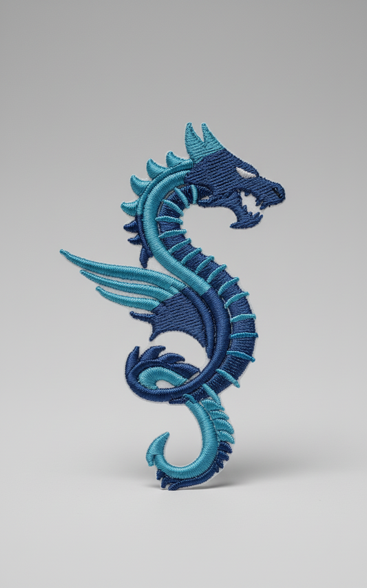 Blue embroidered flying blue dragon  design on a grid background
