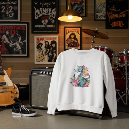 White sweatshirt displayed in a music studio with guitar, amplifier, and drum set, featuring a floral dragon embroidery design with pink flowers on the chest