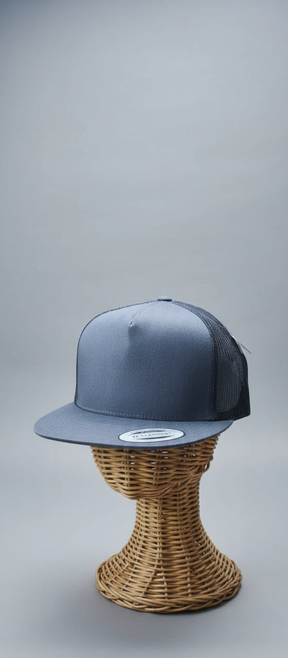 Blue cap on a mannequin head with a blurred background