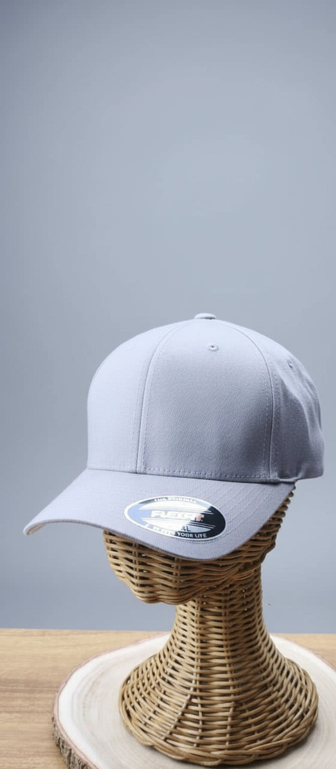 Gray cap on a wicker stand with a blurred background