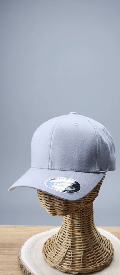 Gray cap on a wicker stand with a blurred background