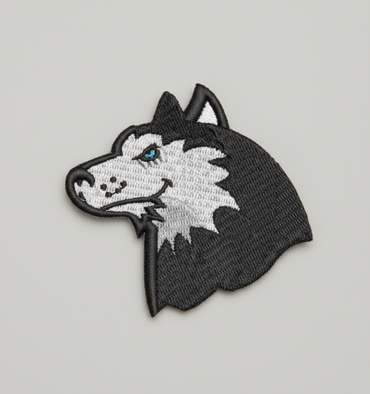 Embroidered patch of a Husky head design on a grid background