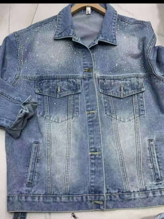 Light-wash denim jacket with subtle rhinestone embellishments on the yoke, flap chest pockets, and rolled sleeves.