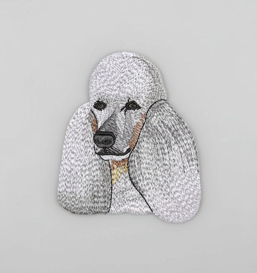Embroidered design of a poodle on a grid background