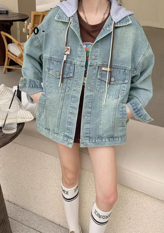 Casual outfit featuring an oversized light-wash denim jacket with attached gray hood, worn over a T-shirt, paired with knee-high white socks.
