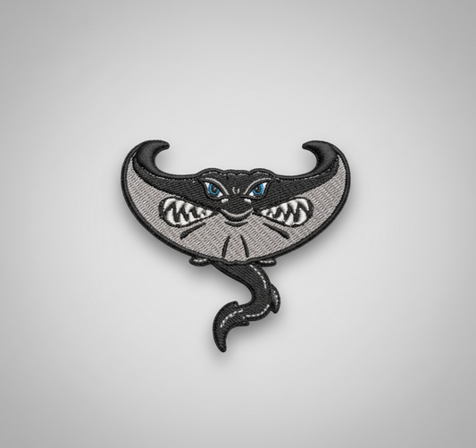 Embroidered design of a stingray on a grid background