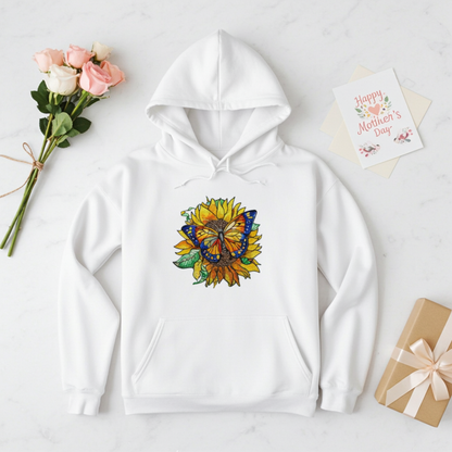 White premium hoodie with Sun-Kissed Butterfly & Sunflower embroidery featuring a blue and orange butterfly on a golden sunflower with green leaves, styled with roses, a Mother’s Day card, and a wrapped gift, original EmbroMania artwork.