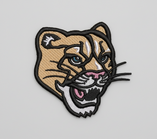 Embroidered patch of a panther's face on a grid background
