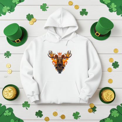 White premium hoodie with Tribal Fire Moose embroidery featuring a moose head with bold antlers and tribal details in warm orange and brown tones, styled on a wooden background with shamrock decorations, green hats, and gold coins, original EmbroMania artwork.