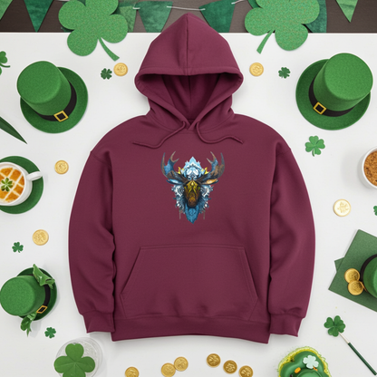 Burgundy premium hoodie with Tribal Moose embroidery featuring a moose head with bold antlers and tribal linework in deep blue, brown, and gold tones, displayed overhead on a white surface with lucky green shamrocks, gold coins, leprechaun hats, and festive St. Patrick's Day styling, original EmbroMania artwork.