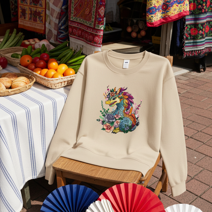 Beige unisex crewneck sweatshirt with vivid bloom dragon embroidery design, hanging on hanger in outdoor cafe setting with festive decor.