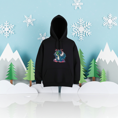 Black hoodie featuring a whimsical blue dragon embroidery design with big eyes and detailed wings, displayed on a mannequin in a winter-themed scene with snowflakes, mountains, and pine trees, original EmbroMania artwork.