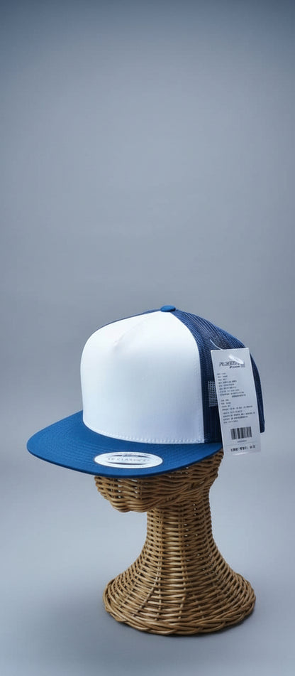 White and blue cap on a wicker stand with a blurred indoor background