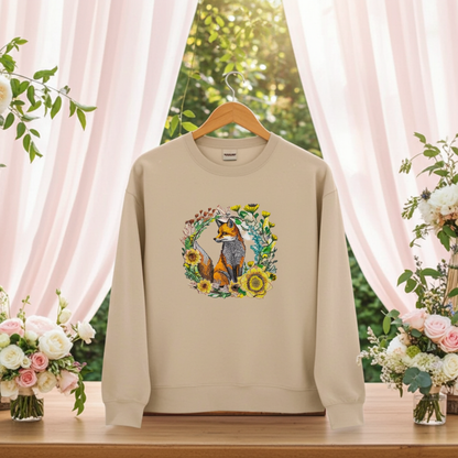 Beige unisex crewneck sweatshirt with wild sunflower fox embroidery in floral wreath design, hanging in floral event setting with draped curtains.