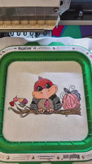 Embroidered Thanksgiving design featuring a cute turkey sitting on a tree branch with autumn leaves and a pumpkin. Perfect for hoodies, sweatshirts, and tote bags.