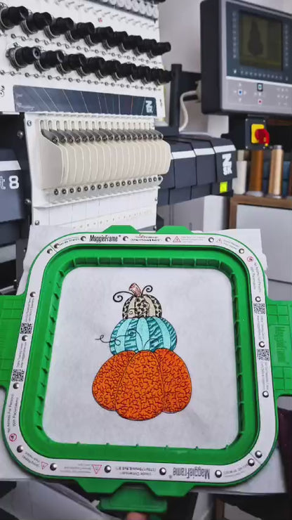 Stacked pumpkin embroidery design, close-up of teal embroidery thread, ending with the Embromania logo.